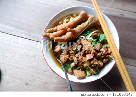 One bowl of traditional Indonesian chicken noodles. This food has a rich, spiced taste. 121093142