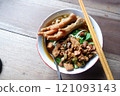 One bowl of traditional Indonesian chicken noodles. This food has a rich, spiced taste. 121093143