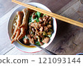 One bowl of traditional Indonesian chicken noodles. This food has a rich, spiced taste. 121093144