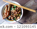One bowl of traditional Indonesian chicken noodles. This food has a rich, spiced taste. 121093145