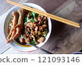 One bowl of traditional Indonesian chicken noodles. This food has a rich, spiced taste. 121093146