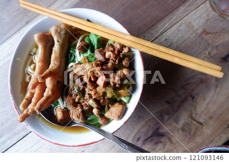 One bowl of traditional Indonesian chicken noodles. This food has a rich, spiced taste. 121093146