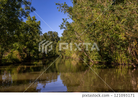 Boat trip on an inner canal in the Marais Poitevin 121093171