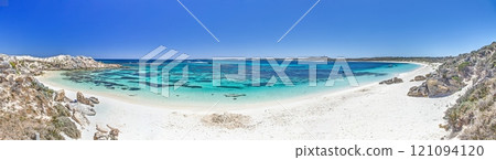 Idyllic beach with turquoise waters and rocky shoreline on Rottnest Island under a bright blue sky Idyllic beach with turquoise waters and rocky shoreline on Rottnest Island under a bright blue sky 121094120