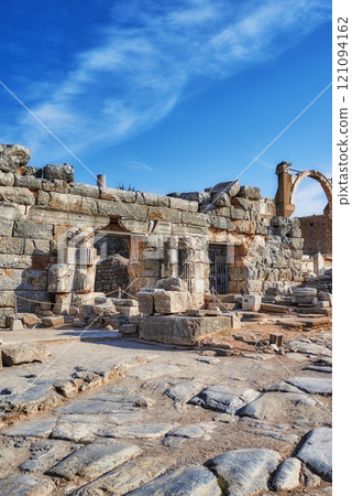Ancient city ruins of Ephesus in Turkey in the day. Traveling abroad and overseas for holiday, vacation and tourism. Excavated remains of historical stone building from Turkish history and culture 121094162