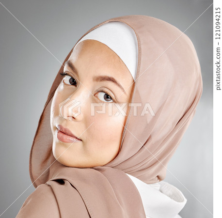 Portrait of hijab wearing traditional muslim woman in arabic style in studio. Headshot of proud cultural arab with beautiful skin against grey background. Elegant fashionable oriental middle eastern 121094215