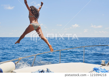 Holiday, woman and jump from boat in ocean for adventure, summer activity or adrenaline for freedom. Back, person or brave girl in bikini for fun getaway, travel or vacation on tropical island mockup 121094218