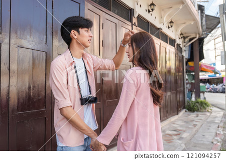 Valentine's day celebration urban street couple interaction romantic atmosphere eye-level view love connection in focus 121094257