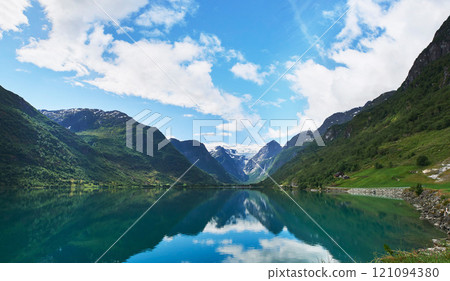 Majestic beautiful fjord landscape in Norway Fjord lake mountain snow water reflection glacial valley Majestic beautiful fjord landscape in Norway Fjord lake mountain snow water reflection glacial valley 121094380