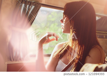 Thinking, woman and relax in van for road trip with sunshine, window view and travel of holiday. Girl, memory and passenger in caravan for countryside vacation, transport and destination adventure 121094393