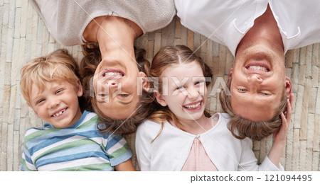 Carefree loving parents from above relaxing with their cute little laughing son and daughter. Happy caucasian family of four relaxing and playing together. Cheerful kids spending time together Carefree loving parents from above relaxing with their cute little laughing son and daughter. Happy caucasian family of four relaxing and playing together. Cheerful kids spending time together 121094495