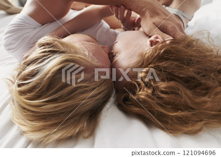 Cuddle, morning or couple sleeping in bed in home for marriage, commitment or loyalty to partner. Resting, love or people lying together for support with romance, care or trust for bonding or break 121094696