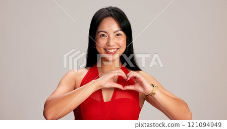 Happy woman, portrait and heart hands, love sign or gesture for romance on grey studio background. Asian female person, smile and emoji with shape, symbol and kindness for valentines day date mockup Happy woman, portrait and heart hands, love sign or gesture for romance on grey studio background. Asian female person, smile and emoji with shape, symbol and kindness for valentines day date mockup 121094949