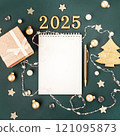 Green with white blank notepad numbers 2025. Concept of planning and setting goals for future. Atmosphere of New Years holiday 121095873
