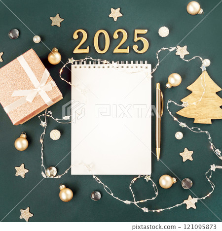 Green with white blank notepad numbers 2025. Concept of planning and setting goals for future. Atmosphere of New Years holiday Green with white blank notepad numbers 2025. Concept of planning and setting goals for future. Atmosphere of New Years holiday 121095873