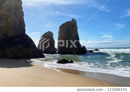 Empty wild sandy beach, Atlantic Ocean seascape, sea waves, beautiful cloudscape, dramatic landscape, travel content, Lisbon, Portugal Empty wild sandy beach, Atlantic Ocean seascape, sea waves, beautiful cloudscape, dramatic landscape, travel content, Lisbon, Portugal 121096550