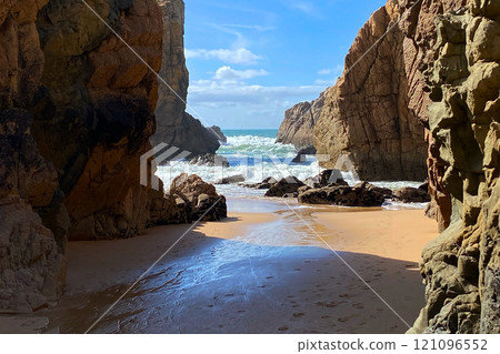 Empty wild sandy beach, Atlantic Ocean seascape, sea waves, beautiful cloudscape, dramatic landscape, travel content, Lisbon, Portugal Empty wild sandy beach, Atlantic Ocean seascape, sea waves, beautiful cloudscape, dramatic landscape, travel content, Lisbon, Portugal 121096552