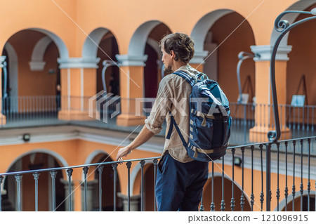 Male tourist in the Biblioteca Palafoxiana, Palafoxiana Library, Puebla, Mexico. Cultural exploration, history, and travel experience concept 121096915