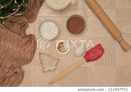 Christmas homemade baking, top view ingredients for baking gingerbread, rolling pin and silicone spatula on the table 121097551