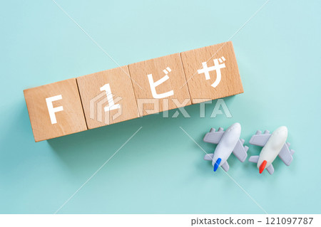 Blocks with the words F1 visa and an airplane Blocks with the words F1 visa and an airplane 121097787