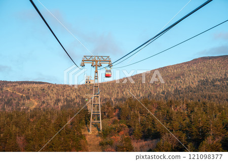 Zao mountain Yamagata Japan, Cable car ropeway ascending a mountain in a scenic landscape. Zao mountain Yamagata Japan, Cable car ropeway ascending a mountain in a scenic landscape. 121098377