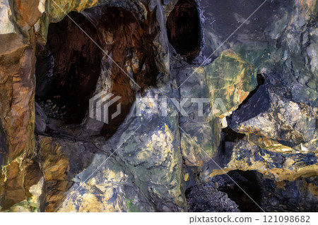 Ginzan onsen, Yamagata, Japan, Rocky cave interior with textured surfaces and shadows. 121098682