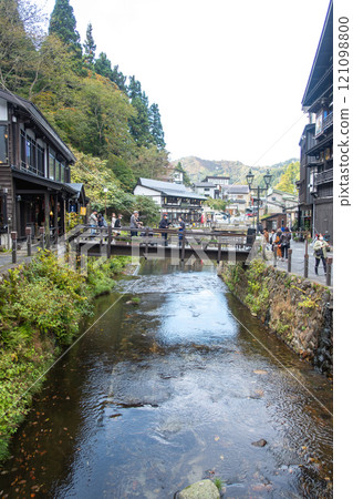 Ginzan onsen, Yamagata, Japan ,Scenic view of a river surrounded by traditional buildings. 121098800