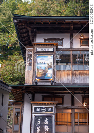 Ginzan onsen, Yamagata, Japan,Traditional building with wooden architecture and signage. Ginzan onsen, Yamagata, Japan,Traditional building with wooden architecture and signage. 121098808