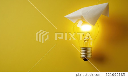Light bulb with paper airplane on top against a vibrant yellow background, AI Light bulb with paper airplane on top against a vibrant yellow background, AI 121099185