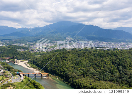 View of the town of Nakatsugawa, Mt. Ena, and the Kiso River from the ruins of Naegi Castle 121099349