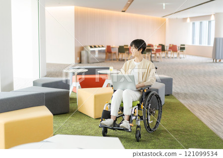 Working female wheelchair user 121099534