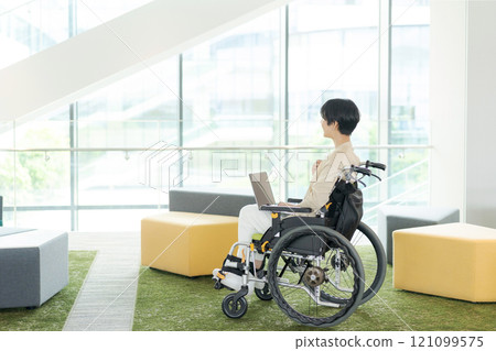 Working woman in a wheelchair 121099575