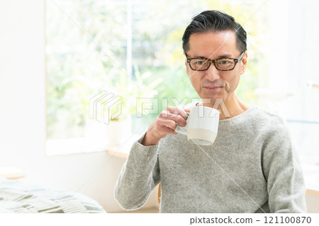 Middle-aged men drinking coffee Middle-aged men drinking coffee 121100870