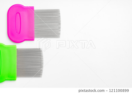 Colorful plastic and metal combs on a white background Colorful plastic and metal combs on a white background 121100899