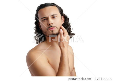 Young man with curly hair thoughtfully posing against a plain background Young man with curly hair thoughtfully posing against a plain background 121100900