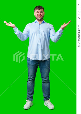 A man playfully posing with a quirky expression against a bright green background A man playfully posing with a quirky expression against a bright green background 121100926