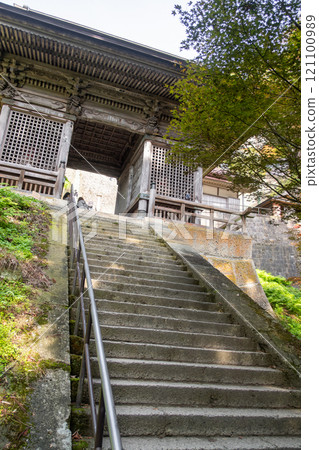 Risshaku-ji Temple at Yamadera, Yamagata, Japan. Stone stairs leading to a traditional building entrance. 121100989