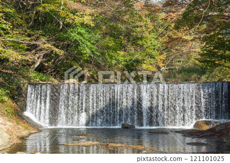 Yamadera, Yamagata, Japan. Waterfall cascading over rocks in a lush green forest Yamadera, Yamagata, Japan. Waterfall cascading over rocks in a lush green forest 121101025
