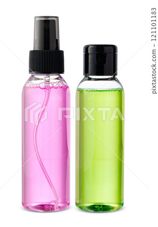 Various bottles with colored liquids and pumps arranged on white background 121101183