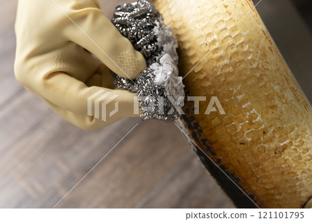 Remove stubborn grease stains from pans 121101795