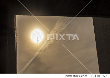 Sun reflected in the window in the evening 121101973