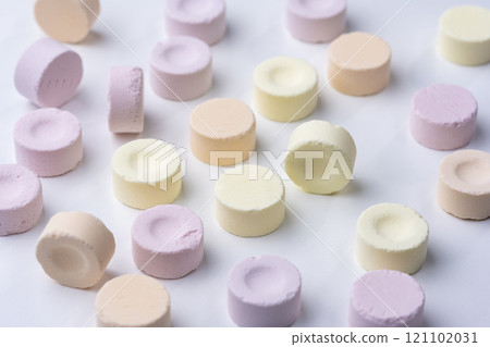 Colorful Ramune candies scattered on a white background 121102031