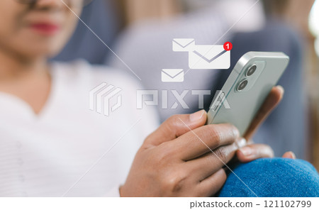 Online communication, online marketing, Data link tech, Woman holding smartphone and touching with virtual icon white newsletter for electronic mail or E-mail with notification alert. 121102799
