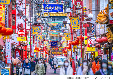 Yokohama cityscape in Japan in December. View of Yokohama Chinatown and Guandi Temple Street. In the background are Ten-Nagato and Yokohama Daisekai (12th) 121102884