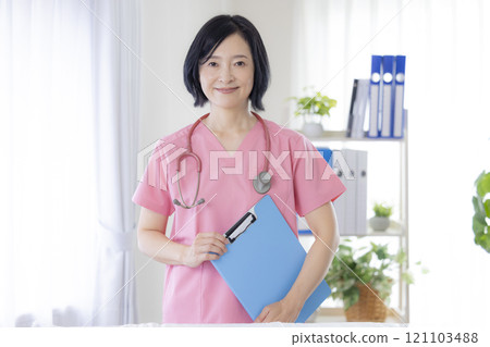 Female doctor working at clinic Female doctor working at clinic 121103488