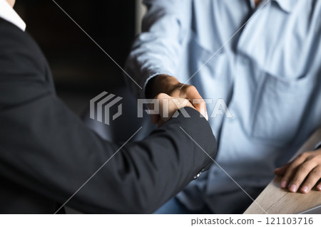 Close up of firm handshake between two businesspeople 121103716