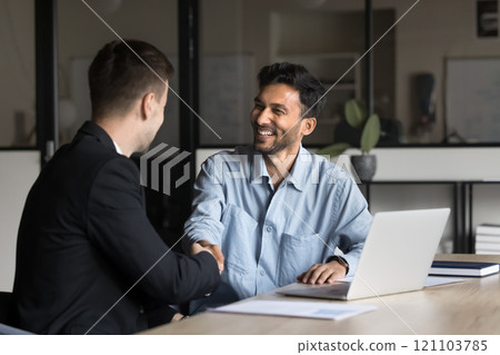 Business partners shaking hands as successful conclusion of meeting Business partners shaking hands as successful conclusion of meeting 121103785