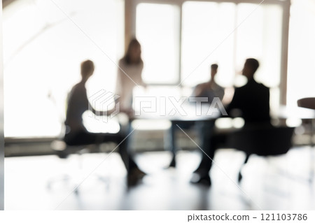 Blurred silhouettes of entrepreneurs participate in business meeting 121103786