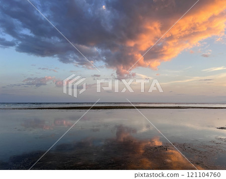 Beautiful sunset on ocean beach. Sky is reflecting at water. Philippines, Bohol 121104760