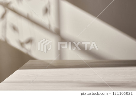 Warm sunlight streaming in through the window, beige background, flowers, vases, and a table with plants. Harmony of light and shadow. 121105021